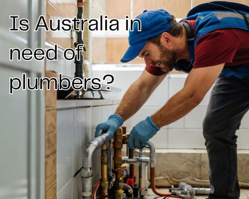 A plumber is working on bathroom fixtures.